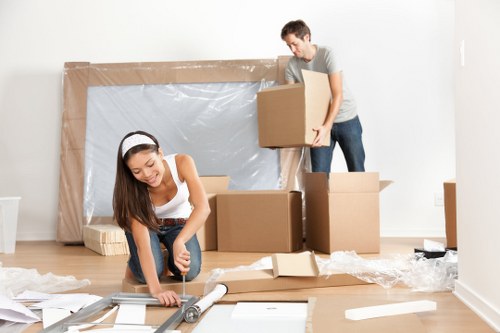 Removal team preparing furniture safely before a move