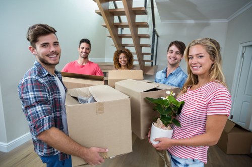 Professional removal services in Merton with moving van and packed boxes