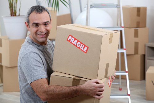 House removalists in Merton loading furniture into a moving truck