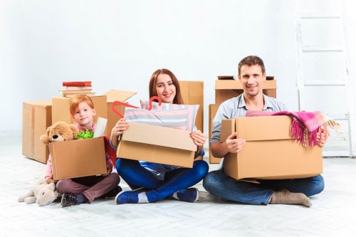 Removal team loading household items into a moving van
