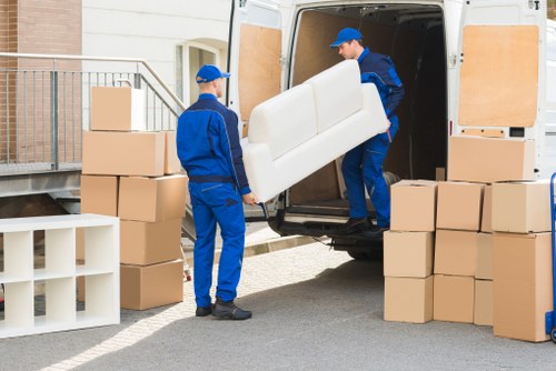 Skilled movers handling furniture and belongings in Merton