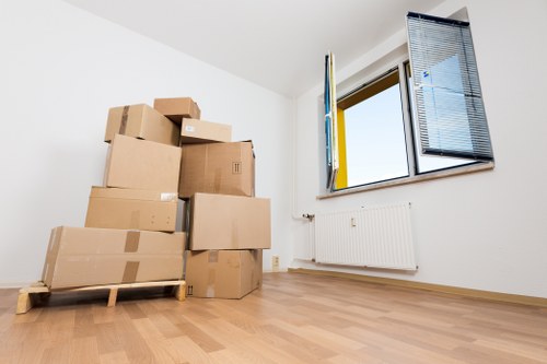 Removalists in Merton unloading boxes and furniture at a new property