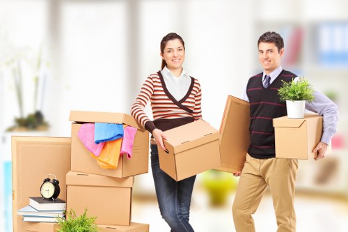 Removal team sorting recyclable packing materials at a property