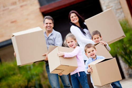 Organized moving boxes prepared for office relocation and storage in Merton