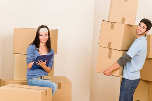 Supervisor assessing hazards in a property before moving items